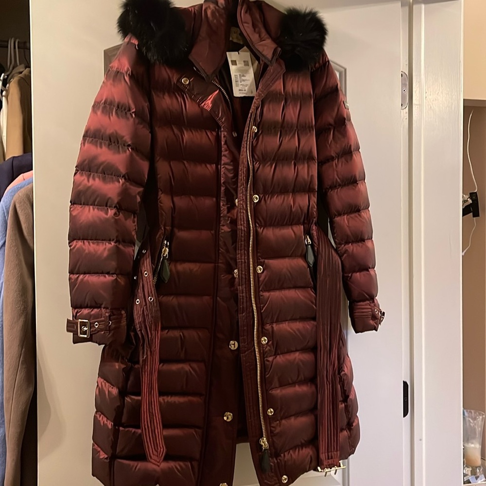 Authentic Burberry burgundy coat with belt and fur hood, new with tag.